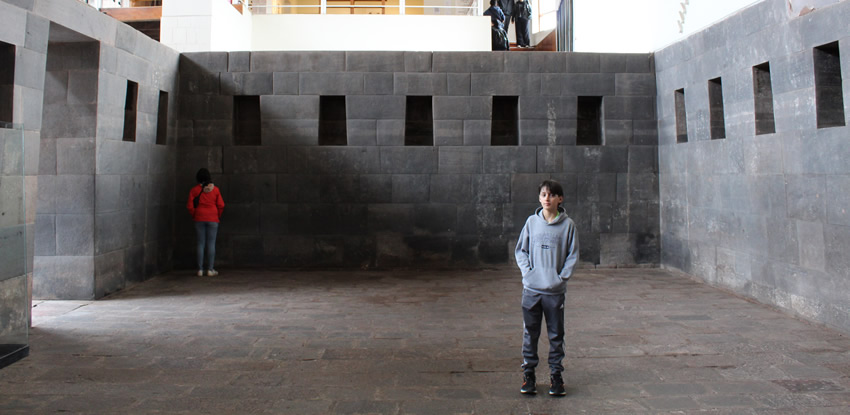 Youth inside of megalithic structure